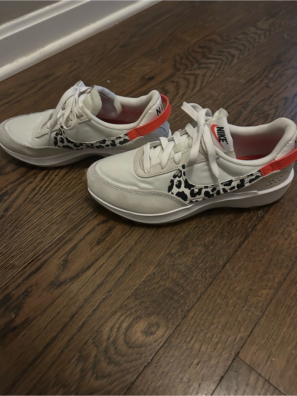 Nike Women’s White Leopard-Print waffle shoes with orange Accent